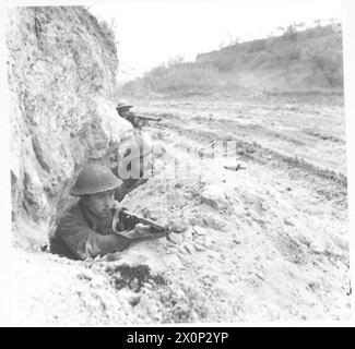 ITALY : EIGHTH ARMY FRONT - Men of the Carleton and York Regiment in slit trenches at the cross roads outside Ortona, wait for signs of a German counter-attack. Photographic negative , British Army Stock Photo