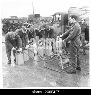 PHOTOGRAPHS TAKEN AT A MOBILE PETROL FILLING CENTRE R.A.S.C. - Filling the 4 gallon returnable can from the portable five point filler machine Photographic negative , British Army Stock Photo