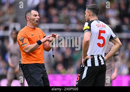 Newcastle Upon Tyne, UK. 13th Apr, 2024. Newcastle, England, Apr 13th 2024: Match referee, Tim Robinson speaks to Fabian Schar of Newcastle United during the Premier League football match between Newcastle United and Tottenham Hotspur at St James Park in Newcastle, England (Will Palmer/SPP) Credit: SPP Sport Press Photo. /Alamy Live News Stock Photo