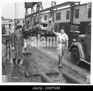 AT A PROOF RANGE - The barrel of a Bofors gun being taken away after proofing Photographic negative , British Army Stock Photo