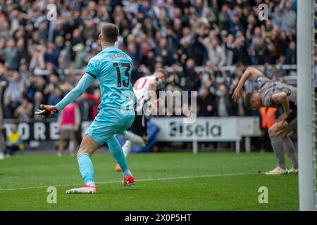 Newcastle United's Anthony Gordon shoots and scores the second goal and leaves Tottenham Hotspur Goalkeeper Guglielmo Vicario stranded during the Premier League match between Newcastle United and Tottenham Hotspur at St. James's Park, Newcastle on Saturday 13th April 2024. (Photo: Trevor Wilkinson | MI News) Credit: MI News & Sport /Alamy Live News Stock Photo