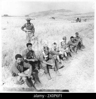 Italian prisoners captured during the invasion of Sicily arrive at a ...