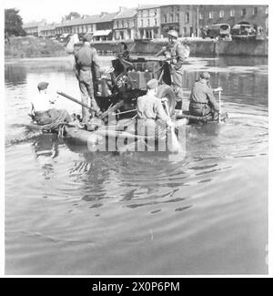 British Army personnel use improvised rafts made by lashing assault ...