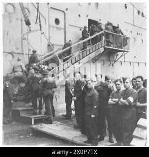 Escorted by British troops, Italian prisoners carry wounded comrades to ...