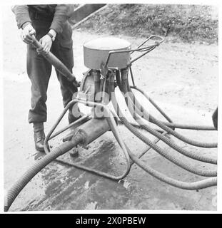 PHOTOGRAPHS TAKEN AT A MOBILE PETROL FILLING CENTRE R.A.S.C. - Puming spirit through the header tank to the five nozzles. Photographic negative , British Army Stock Photo