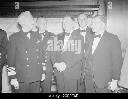 DINNER TO COLONEL KNOX AT GREENWICH COLLEGE. 23 SEPTEMBER 1943. A DINNER WAS HELD IN THE PAINTED HALL, THE ROYAL NAVAL COLLEGE GREENWICH, TO COLONEL FRANK KNOX, SECRETARY TO THE US NAVY. BEFORE HIS PASSAGE TO GREENWICH COLONEL KNOX INSPECTED SEA CADETS AT WESTMINSTER PIER. - Mr A V Alexander (front right) and Col Knox (third for right) with Admiral H Stark, USN (left) and Admiral Sir John Tovey, MCB, KBE, DSO, C in C Nore (second from left); and the Dean of the College, Capt Akhurst (2nd from right) Stock Photo
