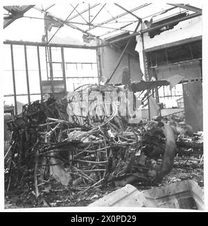 TUNIS AIRPORT : ANOTHER GRAVEYARD OF GOERING'S LUFTWAFFE - All the remains of an aircraft workshop. Photographic negative , British Army Stock Photo