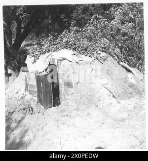 ITALY : FIFTH ARMYANZIO BRIDGEHEADTHE WORLD'S SMALLEST CINEMA - 'Anzio Odeon' a dug-out sandbagged and camouflaged where films are shown to the men. Photographic negative , British Army Stock Photo