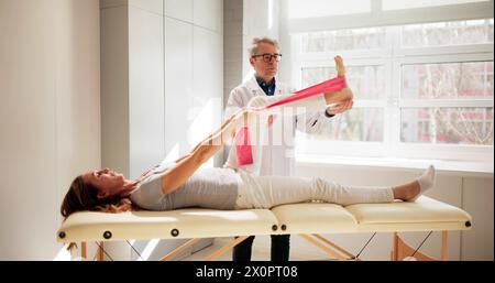 Therapy Band Exercise. Therapeutic Physio Rehab Training Stock Photo