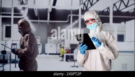 Factory Clean Room Laboratory. Industrial Engineer Using Technology Stock Photo