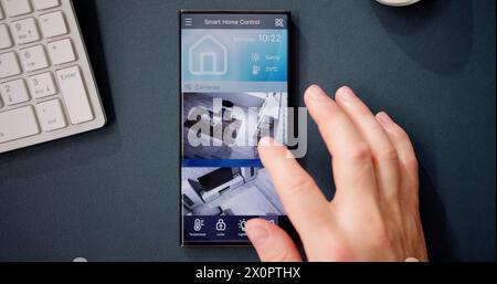 Smart Home CCTV Security On Mobile Phone Or Smartphone Stock Photo