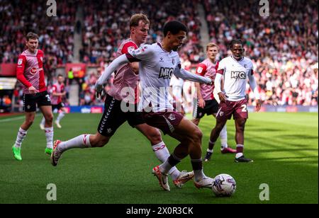 Watford's Jamal Lewis and Southampton's James Bree in action during the Sky Bet Championship match at St Mary's Stadium, Southampton. Picture date: Saturday April 13, 2024. Stock Photo