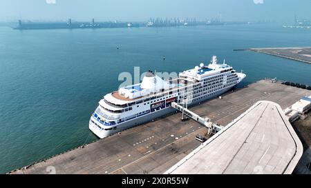 Tianjin. 13th Apr, 2024. An aerial drone photo taken on April 13, 2024 shows the Silver Shadow cruise ship, operated by the Royal Caribbean Group, docking at Tianjin International Cruise Home Port in north China's Tianjin Municipality. TO GO WITH 'Economic Watch: China's Tianjin port welcomes three int'l cruise ships within a week' Credit: Xinhua/Alamy Live News Stock Photo