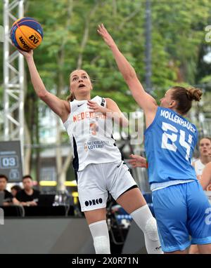Hong Kong, China. 13th Apr, 2024. Loyce Bettonvil (L) of the Netherlands shoots during the women's Pool B match between the Netherlands and Azerbaijan at the FIBA 3X3 Universality Olympic Qualifying Tournament in Hong Kong, south China, April 13, 2024. Credit: Lo Ping Fai/Xinhua/Alamy Live News Stock Photo