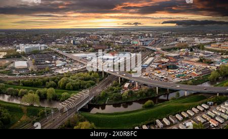 Aerial landscape view of Doncaster cityscape skyline with rail and road transport links serving the South Yorkshire city centre at sunrise Stock Photo