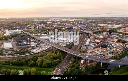 Aerial landscape view of Doncaster cityscape skyline with rail and road transport links serving the South Yorkshire city centre at sunrise Stock Photo