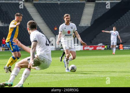 Milton Keynes Dons Alex Gilbey during the second half of the Sky Bet League 2 match between MK Dons and Mansfield Town at Stadium MK, Milton Keynes on Saturday 13th April 2024. (Photo: John Cripps | MI News) Credit: MI News & Sport /Alamy Live News Stock Photo