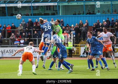 Harry Lewis of Carlisle United punches the ball clear during the Sky Bet League 1 match Carlisle United vs Blackpool at Brunton Park, Carlisle, United Kingdom, 13th April 2024  (Photo by Gareth Evans/News Images) Stock Photo