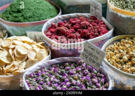 Dried traditional herbs and spices at Souq Waqif in Doha, Qatar. There are chamomile, banana, rose flowers and others, many of which are made in Iran. Stock Photo