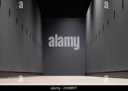 A row of closed gray cabinets in a corridor Stock Photo