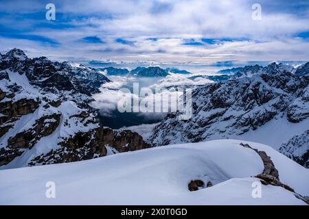 Aerial view of the Auronzo valley and snow-covered alpine Dolomite landscape in winter, seen from Rifugio Auronzo in Tre Cime Natural Park. Misurina V Stock Photo