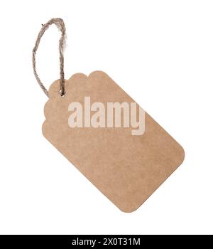 Brown kraft label, empty blank paper tag in twine, string, rope isolated on white background. Stock Photo