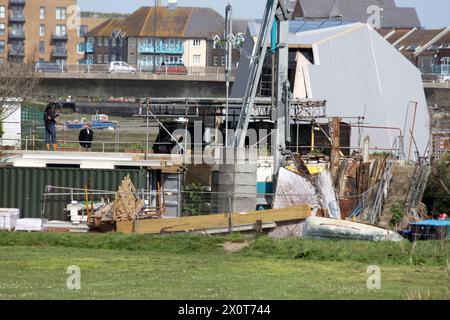 Channel 4 TV presenter Kevin McCloud of the Grand Designs programme visiting a houseboat build at Shoreham by Sea West Sussex Stock Photo