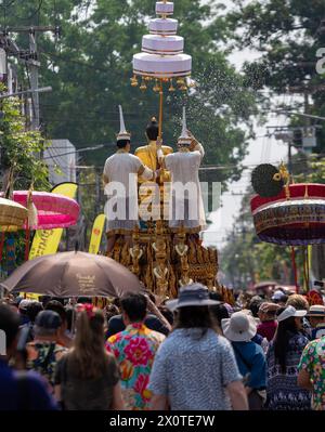 Chiang Mai, Thailand. 13th Apr, 2024. Thai people wearing traditional costumes seen during The Phra Buddha Sihing Buddha statue procession to mark Songkran celebrations at Wat Phra Singh Woramahaviharn temple. The festive Songkran is also known as the water festival which is celebrated on the Thai traditional New Year's day annually on 13 April by spraying water and throwing powder at each others faces as a symbolic sign of cleansing and washing away the sins from the past year. (Credit Image: © Pongmanat Tasiri/SOPA Images via ZUMA Press Wire) EDITORIAL USAGE ONLY! Not for Commercial USAGE! Stock Photo