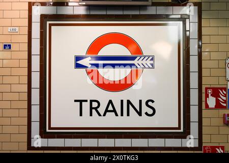 London, UK - March 23, 2024; Roundel with arrow to trains at Great Portland Street Underground Station Stock Photo