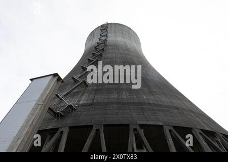 Cooling tower of the decommissioned Satsop Nuclear Power Plant looms over the Satsop Development Park in Elma Washington on Saturday, April 13, 2024. Stock Photo