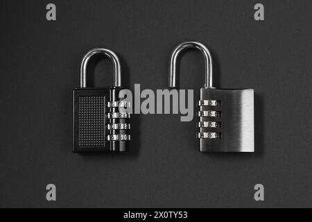 Steel combination padlocks on black background, top view Stock Photo