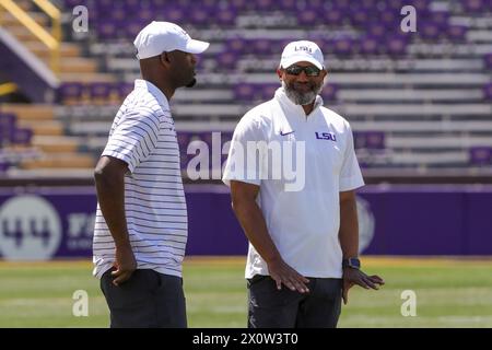 Baton Rouge, LA, USA. 13th Apr, 2024. LSU Assistant Coach Corey Raymond talks with another coach during the annual National L Club LSU Spring Game at Tiger Stadium in Baton Rouge, LA. Jonathan Mailhes/CSM/Alamy Live News Stock Photo