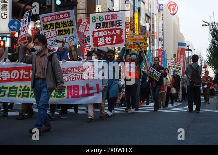 Tokyo, Japan. 13th Apr, 2024. Several hundred people take part in an anti-war protest in the streets of Shinjuku. The protest was organized by left-wing groups and broadly called for an end to the war in Gaza along with anti-government messages concerning the revision of Japan's constitution and the war in Ukraine. Credit: SOPA Images Limited/Alamy Live News Stock Photo