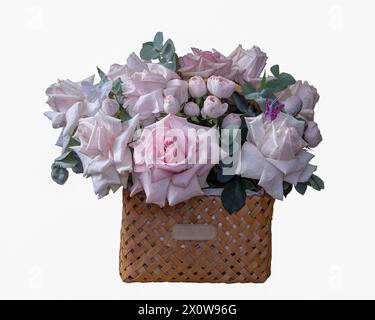 Bouquet of pink roses in a basket isolated Stock Photo