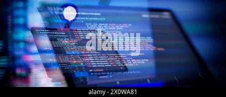 Working atmosphere of a programmer at home, background. Programming code abstract Stock Photo