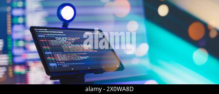 Working atmosphere of a programmer at home, background. Programming code abstract Stock Photo