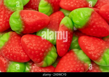 Jelly strawberry candies isolated on a white background. Top view. Delicious gelatin candies. Stock Photo