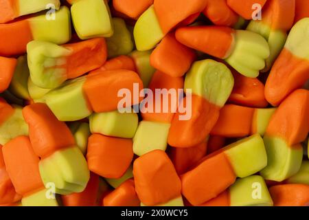 Juicy colorful jelly sweets isolated on white. Gummy candies. Jelly carrots. Stock Photo