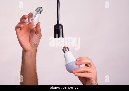 replacing an old lamp with an LED one Stock Photo