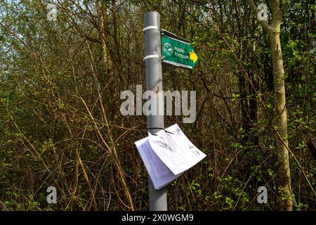 Wendover, UK. 13th April, 2024. A notice from HS2 posted on a lampost next to one of the many footpaths that have been closed by HS2. HS2 have now temporarily realigned part of Ellesborough Road in Wendover, Buckinghamshire as part of the HS2 High Speed Rail construction works. A new road has been built behind the remaining cottages. A number of cottages in Ellesborough Road have been demolished by HS2 whilst some were the subject of compulsory purchase but remain empty. The part of Ellesborough Road in front of the remaining cottages is now a dead end and only accessible by residents. This is Stock Photo