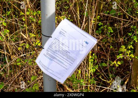 Wendover, UK. 13th April, 2024. A notice from HS2 posted on a lampost next to one of the many footpaths that have been closed by HS2. HS2 have now temporarily realigned part of Ellesborough Road in Wendover, Buckinghamshire as part of the HS2 High Speed Rail construction works. A new road has been built behind the remaining cottages. A number of cottages in Ellesborough Road have been demolished by HS2 whilst some were the subject of compulsory purchase but remain empty. The part of Ellesborough Road in front of the remaining cottages is now a dead end and only accessible by residents. This is Stock Photo