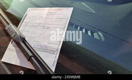Police report on the windscreen of the car, Local Police Italy. Stock Photo