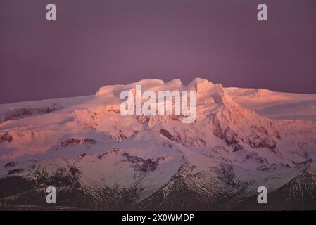 Winter sunrise over snow covered volcanic peaks, Iceland Stock Photo