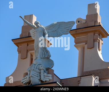 GENOVA, ITALY, JULY 26, 2023 - Victory Angel statue of the fascist regime on the top of an historic building of Genoa, Italy Stock Photo