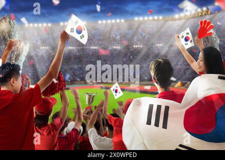 South Korea football supporter on stadium. Korean fans on soccer pitch watching team play. Group of supporters with flag and national jersey cheering Stock Photo