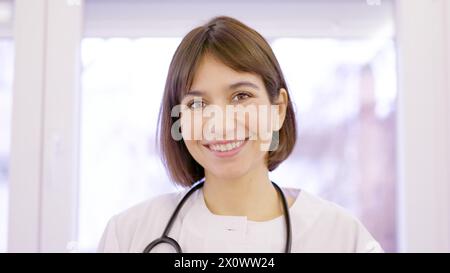 Female doctor smiling at camera in the clinic Stock Photo
