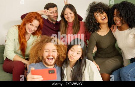 Multi-ethnic friends taking a selfie at home Stock Photo