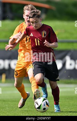 Sil Blokhuis (17) of The Netherlands and Andrea Di Benedetto (11) of Belgium pictured during a friendly soccer game between the national under 16 Futures teams of The Netherlands and Belgium on  Saturday 13 April 2024  in Tubize , Belgium . PHOTO SPORTPIX | David Catry Stock Photo
