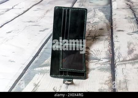 Black wallet made of genuine leather. Stock Photo