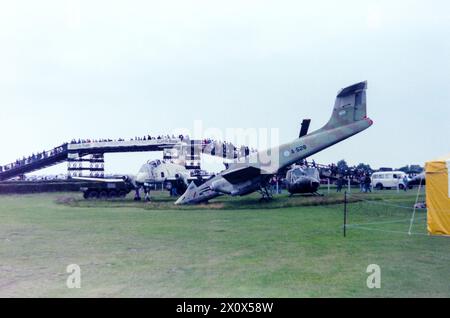 Falklands War damaged Argentine Air Force FMA IA-58 Pucara aircraft and Bell UH-1 Iroquois helicopter brought back to the UK and on display outside the Army Flying Museum at Middle Wallop, Hampshire, UK in 1986. Captured 'War booty'. Found by British forces at Port Stanley airfield in the Falklands A-528 joined a quantity of items shipped back to the UK after the conflict. Later repaired and put on display at Norfolk and Suffolk Aviation Museum, Flixton, UK Stock Photo